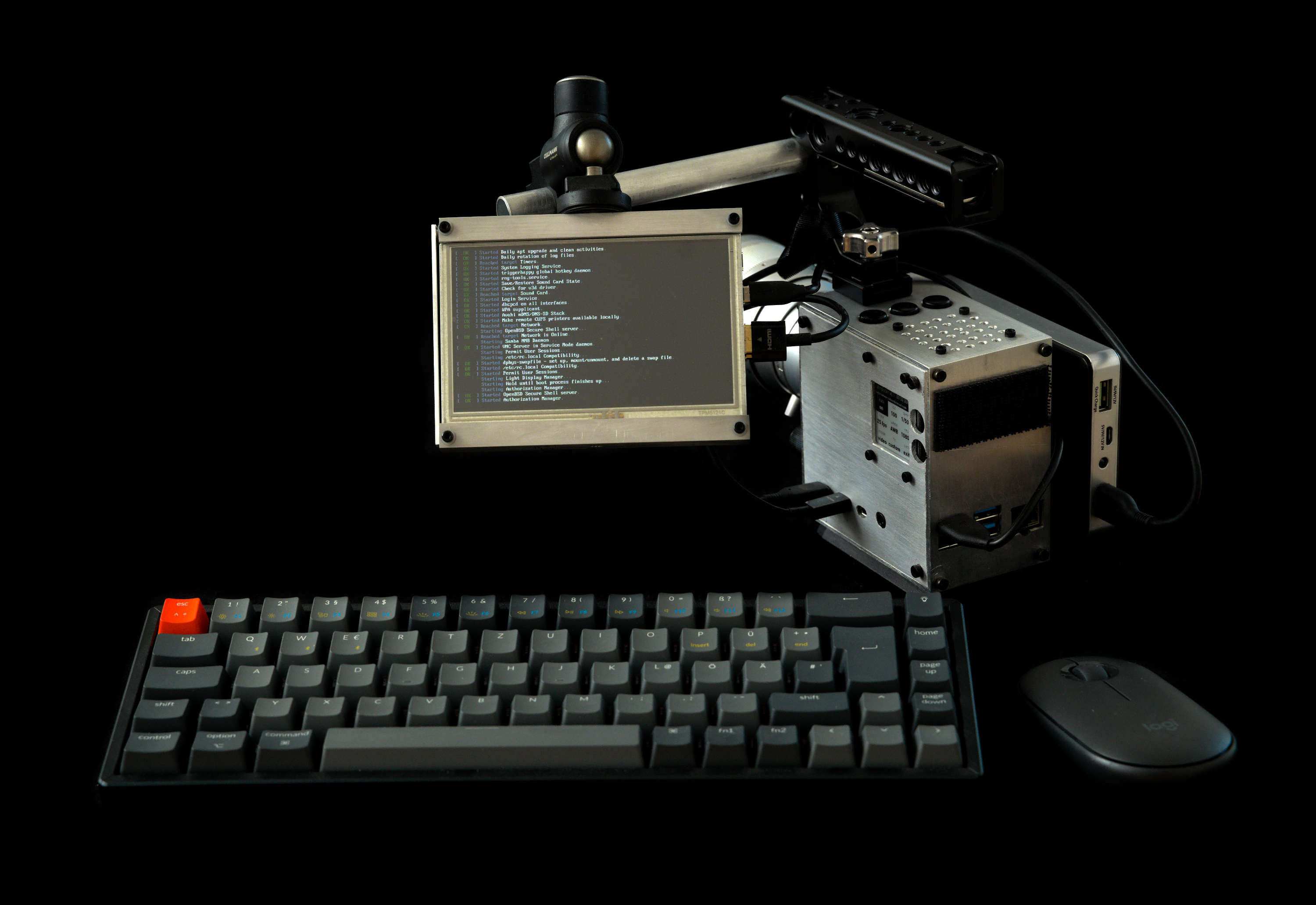 camera setup as a computer showing linux bootscreen with mouse and keyboard